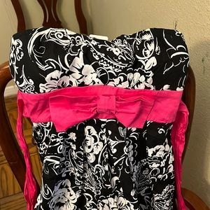 Black and white dress with pink tie and bow zip up dress